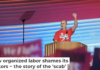 United Auto Workers President Shawn Fain wears a shirt reading ‘Trump is a Scab’ at the Democratic National Convention on Aug. 19, 2024. Andrew Harnik/Getty Images